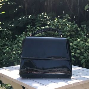 Vintage black patent small top handle purse.